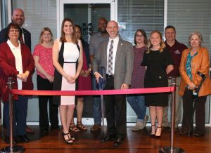 The Montgomery Center for America's Veterans staff led by Director Brian Locke (front row 3rd from right) and MSU-Meridian head of campus Terry Dale Cruse (back row far left) along with MSU-Meridian staff celebrate the opening of a new veteran lounge at MSU-Meridian's College Park Campus. (Photo by Lisa Sollie)